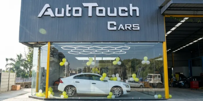 Best Car Studio showroom with luxury white car display at Auto Touch Cars