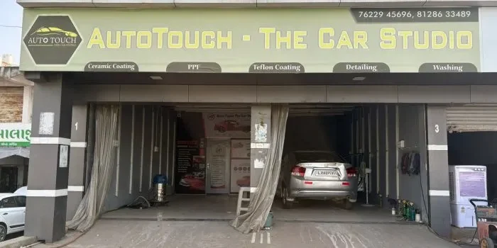 Auto detailing experts providing professional car detailing, ceramic coating, PPF installation, and vehicle protection services at a modern car care studio.